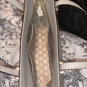beige kate spade purse